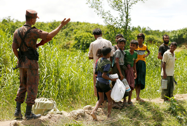 Members of Border Guard Bangladesh (BGB) stops Rohingya people who are trying to enter Bangladesh in Cox’s Bazar, Bangladesh, August 27, 2017. Credit: Reuters