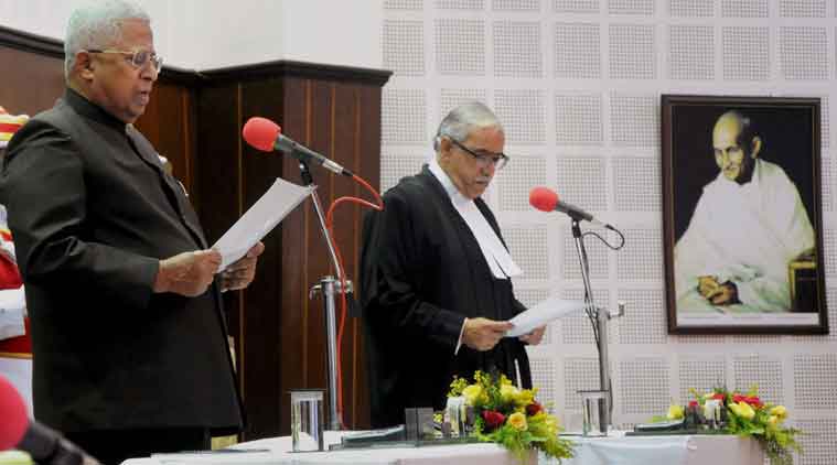 Tathgata Roy (L) being sworn in as governor of Tripura in 2015. Credit: PTI/Files