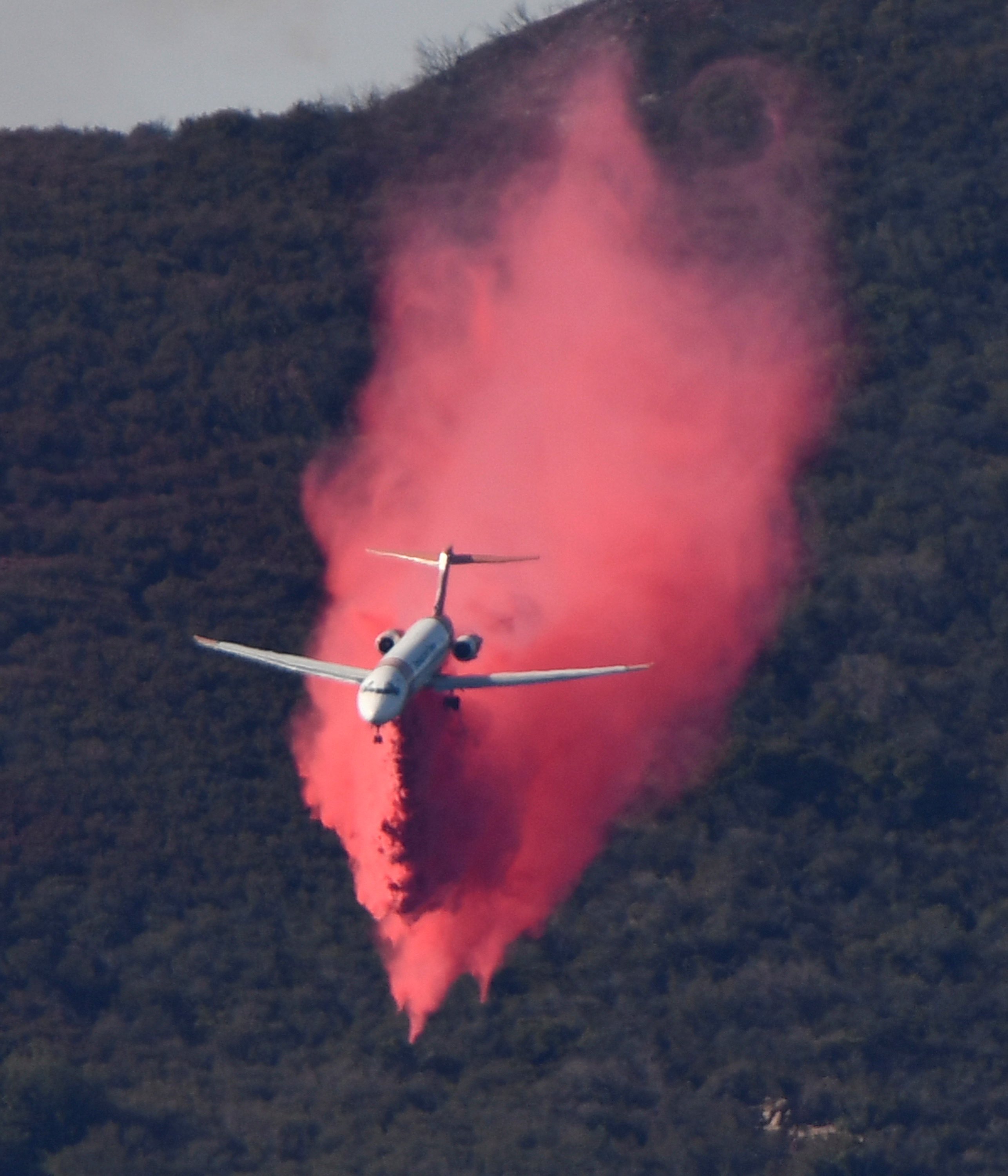 firefighters hold back massive wildfire in southern california