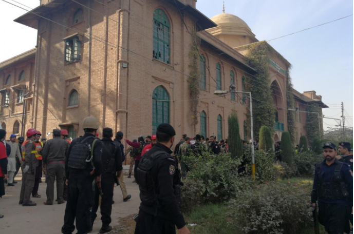 nine killed as taliban disguised in burqas attack college in pakistan