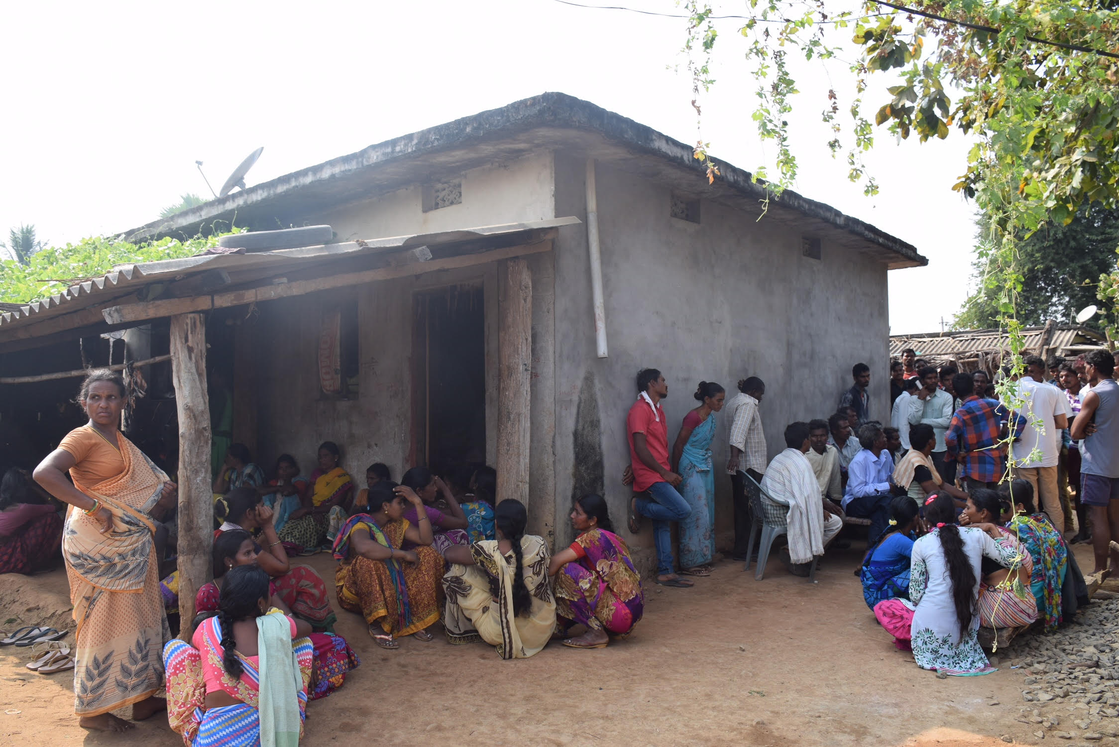 Relatives of Etti Seenu gather at his house in Marigudem village. Seenu was cremated on Friday. Credit: Sukanya Shantha