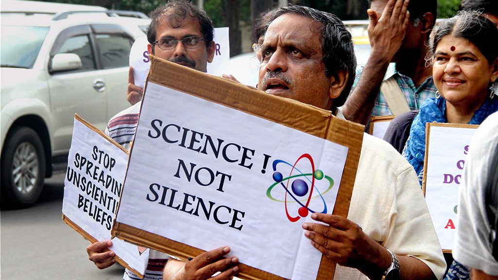 People holding placards at a 'March for Science' protest in August 2017. Credit: PTI