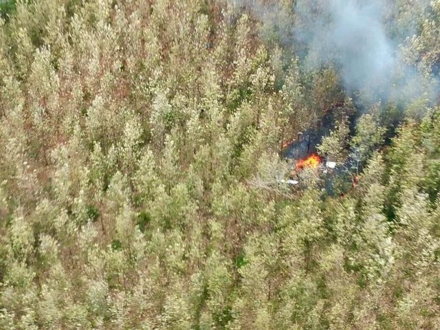 Smoke rises from wreckage after a plane crashed in the mountainous area of Punta Islita, in the province of Guanacaste, in Costa Rica December 31, 2017 in this picture obtained from social media. Ministerio de Seguridad Publica de Costa Rica/via Reuters
