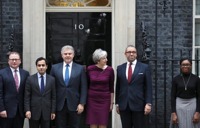 Britain's Prime Minister Theresa May poses with Brandon Lewis and James Cleverly and other members of their teams outside 10 Downing Street, London, January 8, 2018. Credit: Reuters/Simon Dawson