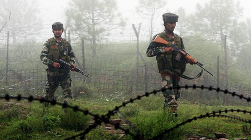 Indian army personnel walking along the India Myanmar border. Credit: PTI