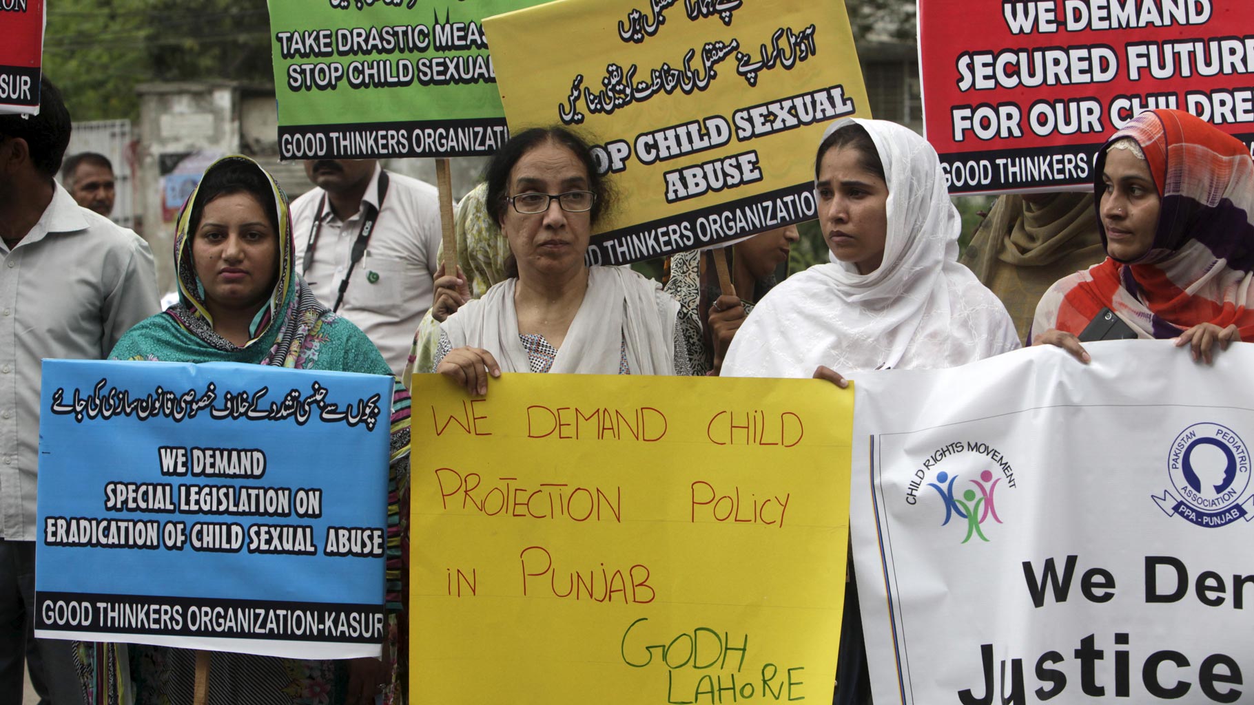 Activists of Pakistani NGO PPA (Pakistan Pediatric Association Punjab) hold placards in a protest against child abuse in Lahore, Pakistan on 13 August, 2015. Credit: Reuters/Files
