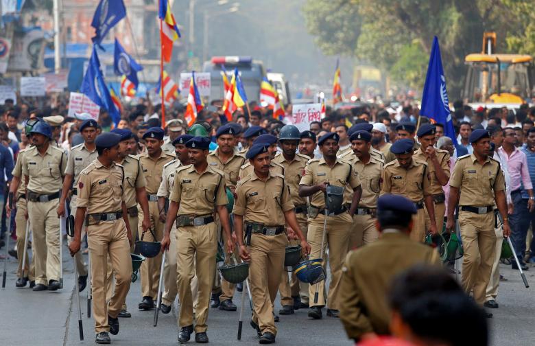 Police patrol a street as members of the Dalit community hold a protest in Mumbai, India, January 3, 2018. Credit: Reuters/Shailesh Andrade