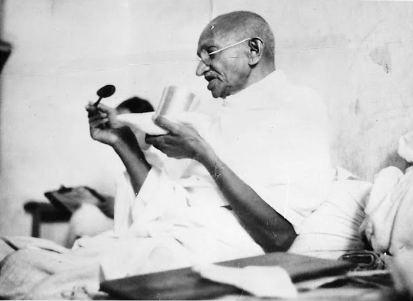 Mahatma Gandhi taking his last meal before the start of his fast, Rajkot, 1939. Credit: Wikimedia Commons