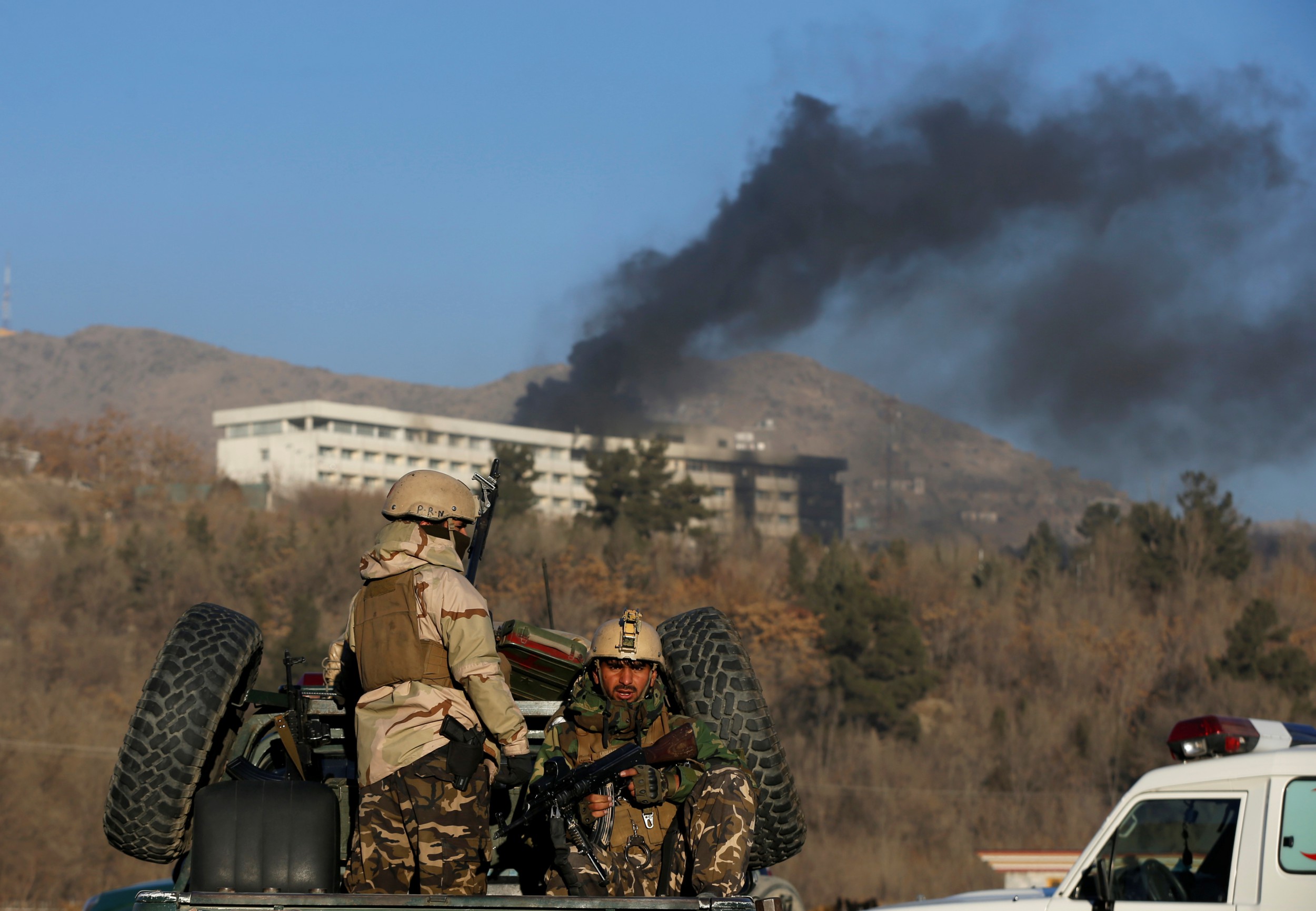 Afghan security forces keep watch as smoke rises from the Intercontinental Hotel in Kabul, Afghanistan, January 21, 2018. Credit: Reuters/Omar Sobhani