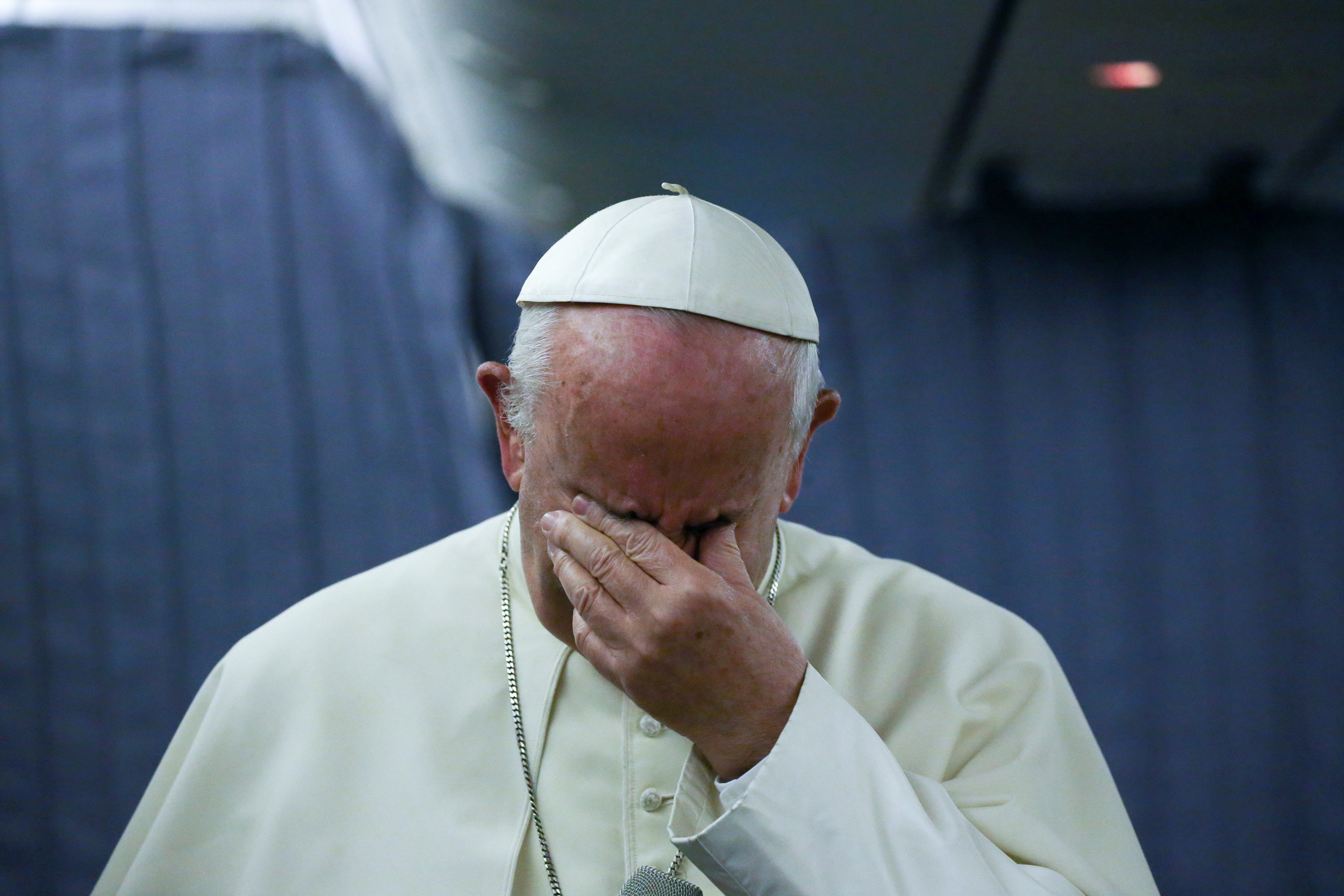 Pope Francis gestures during a news conference on board of the plane during his flight back from a trip to Chile and Peru, January 22, 2018. Credit: Reuters/Alessandro Bianchi