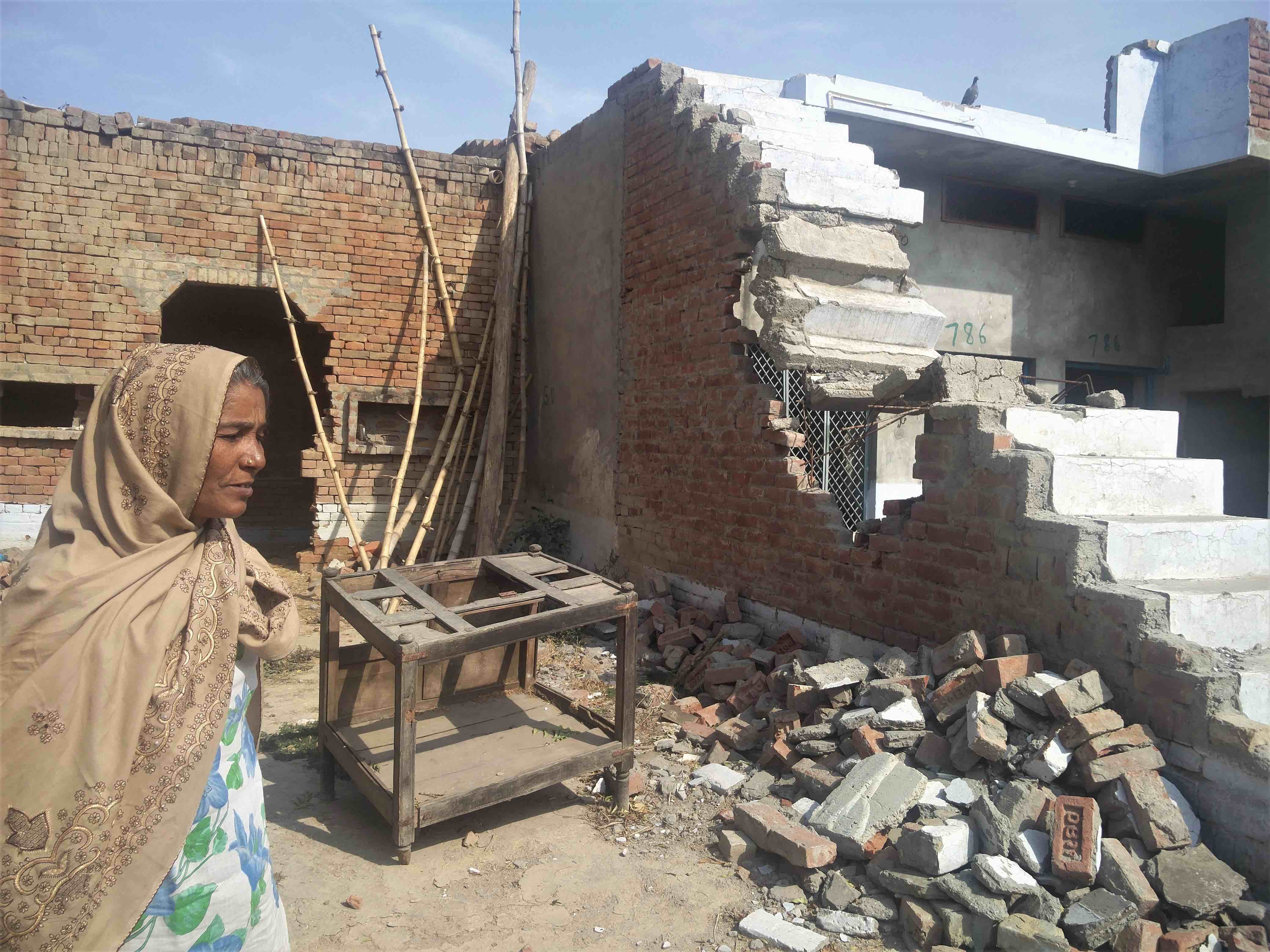 Meena, Vasim's mother, in her house broken down by the cops. Credit: Neha Dixit
