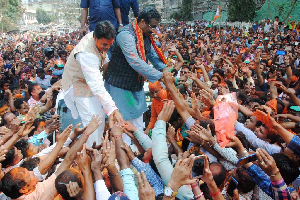 BJP national general secretary Ram Madhav and Tripura BJP chief Biplab Kumar Deb greet the supporters after party's victory in Tripura assembly elections in Agartala on Saturday. BJP's win marks an end to 25 years of CPI(M) rule in the state. Credit: PTI
