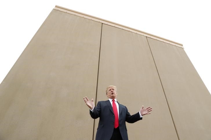 US President Donald Trump speaks while participating in a tour of US-Mexico border wall prototypes near the Otay Mesa Port of Entry in San Diego, California. US, March 13, 2018. Credit: Reuters/Kevin Lamarque/Files