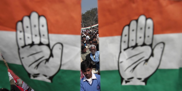 File photo of Congress workers holding party flags. Credit: Reuters/Adnan Abidi
