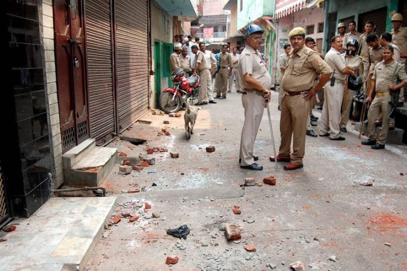 File photo of policemen standing in strret of riot-affected Muzaffarnagar in 2013. Credit:PTI