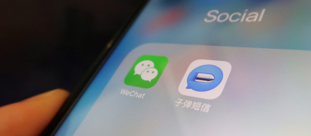 Chinese instant messaging app Bullet Messenger is seen next to Tencent's Wechat app on a mobile phone in this illustration picture taken September 4, 2018. Credit: REUTERS/Florence Lo/Illustration/Files