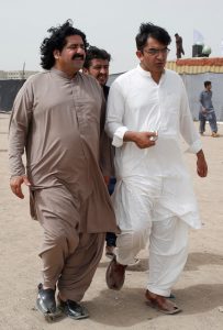FILE PHOTO: Ali Wazir (L) and Mohsin Dawar, leaders of the Pashtun Tahaffuz Movement (PTM) walks at the venue of a rally against, what they say, are human rights violations by security forces, in Karachi, Pakistan May 13, 2018. Credit: REUTERS/Akhtar Soomro/File Photo