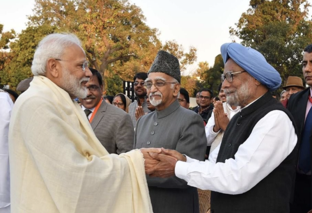 Prime Minister Narendra Modi with former Prime Minister Manmohan Singh and former Vice-President Mohammad Hamid Ansari