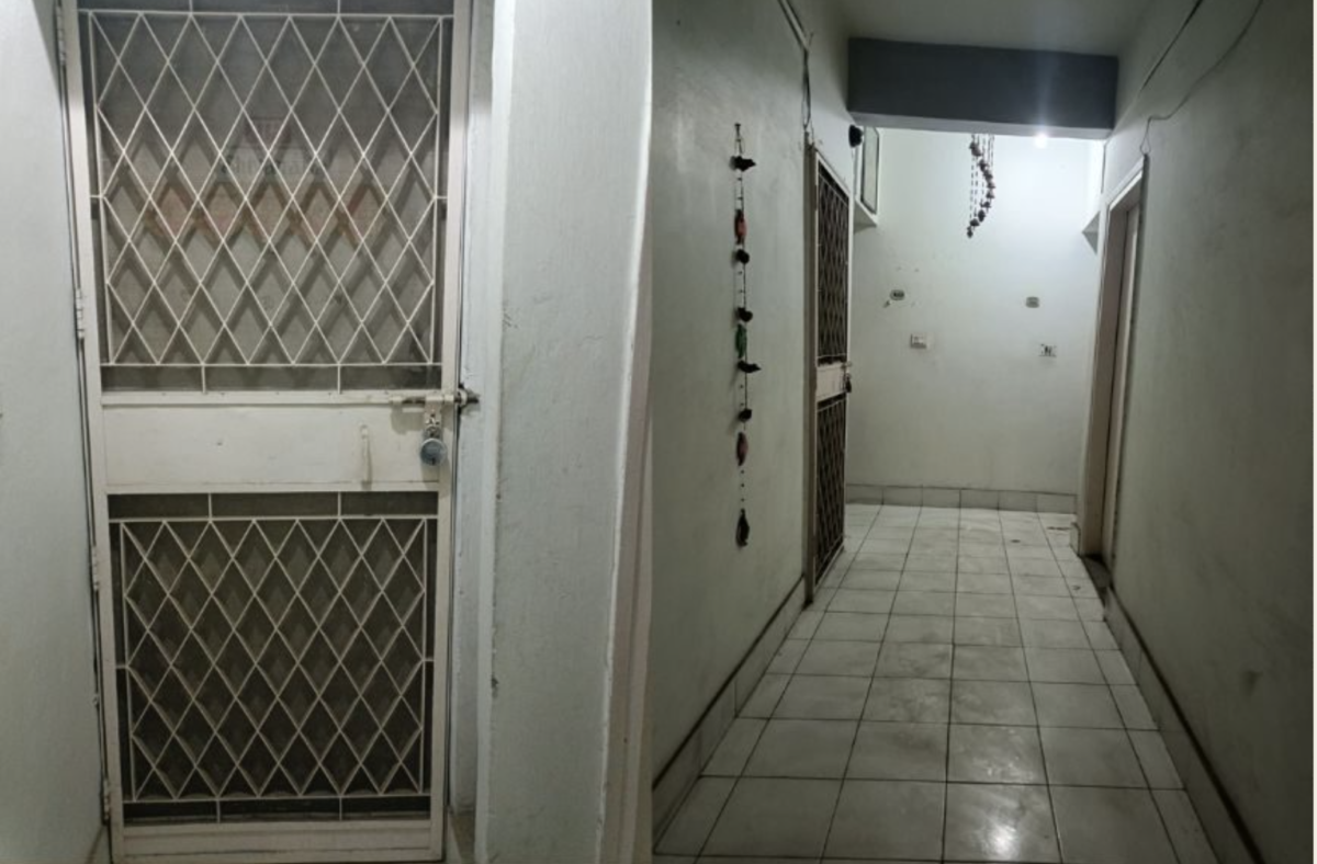 Caption: Locked door of Krishna Sobti's house (left) Front corridor (right).