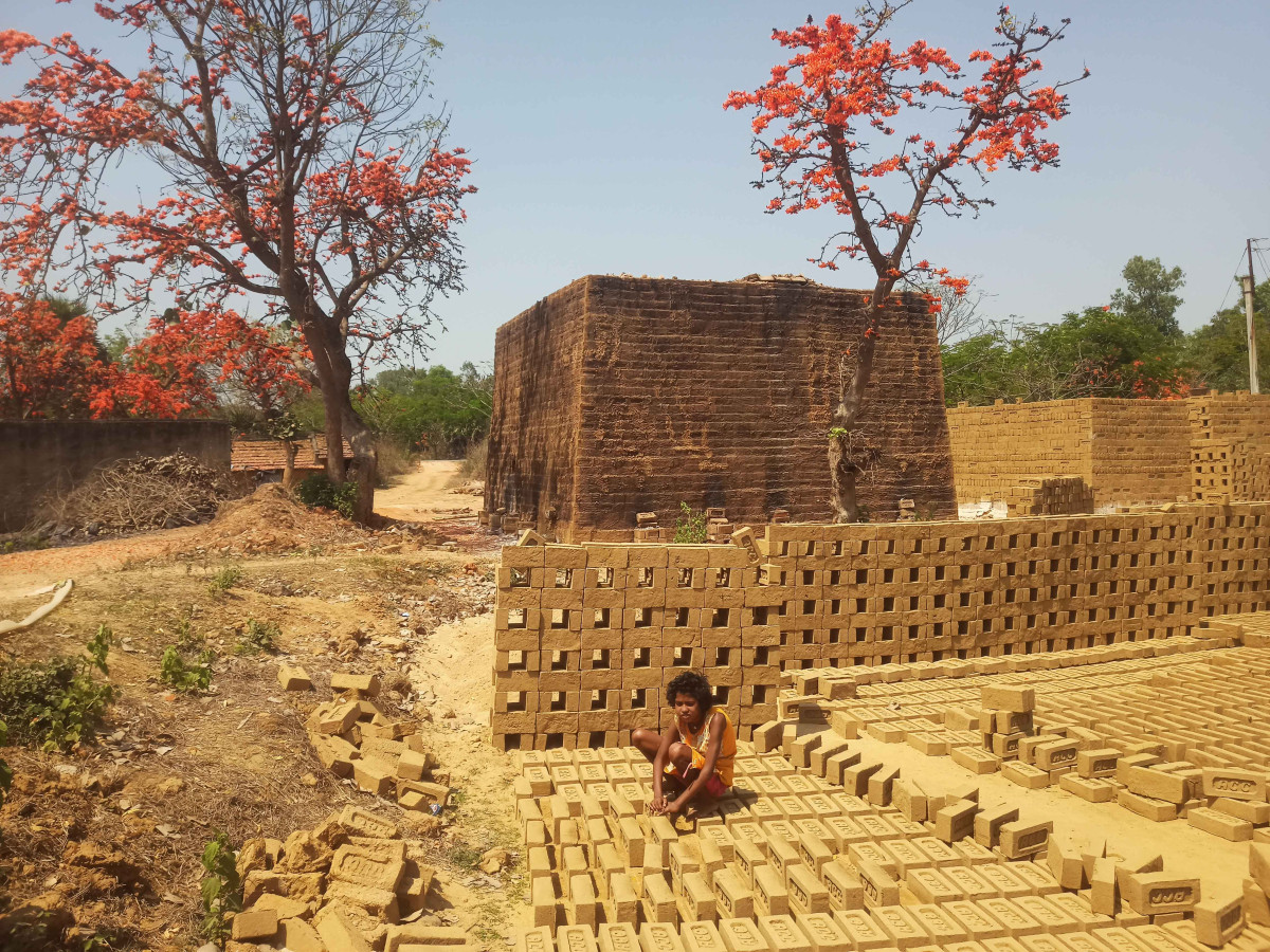 Twelve-year-old Sima Bauri had to leave school. Now she works at a brick kiln at Poyabagan, Bankura.