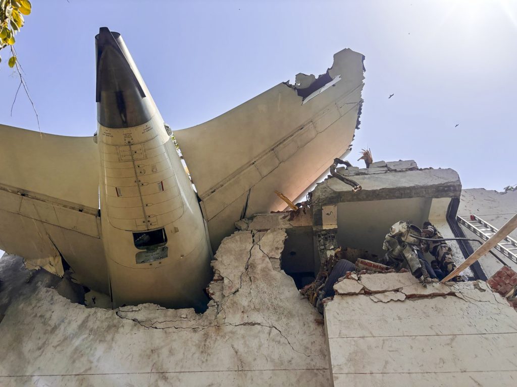 The rear of Air India flight 171 is seen lodged in a building in Ahmedabad.