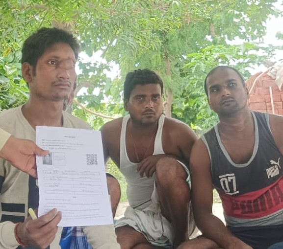 Citizens holding up the form while filling them.