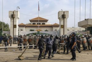 Kathmandu: Security personnel pull a barricade outside Nepal's Parliament amid massive anti-government protests, in Kathmandu, Nepal