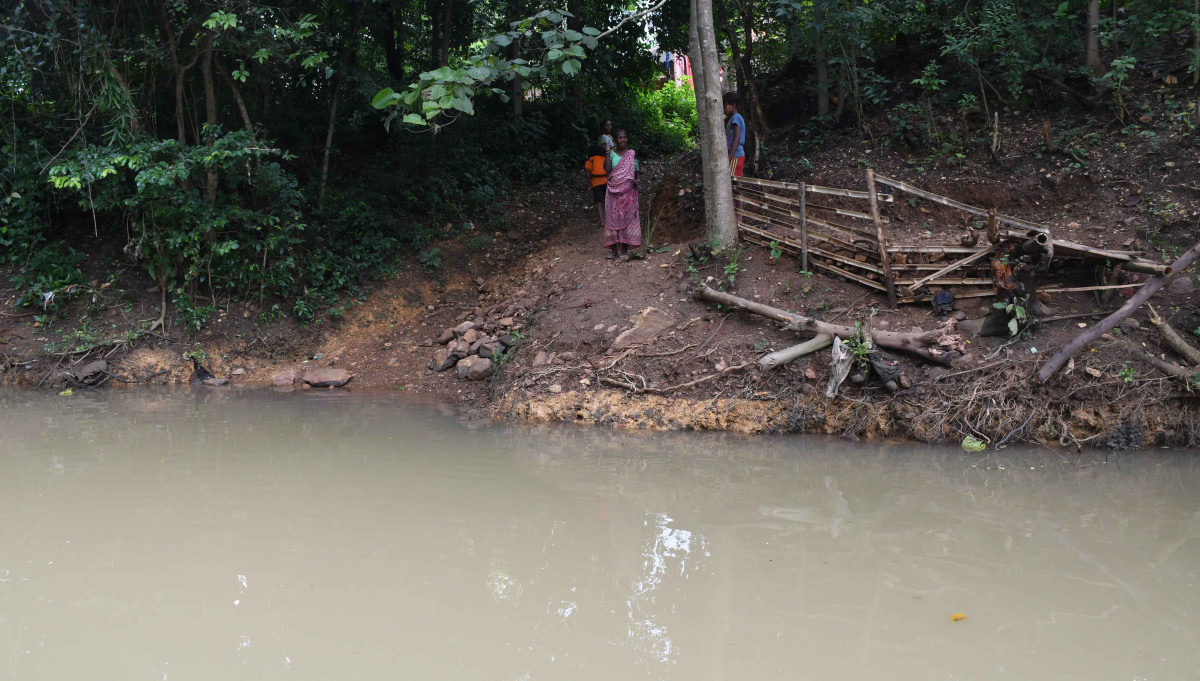 Dulung river in the monsoon. Due to the absence of a bridge, people cross the river by swimming.