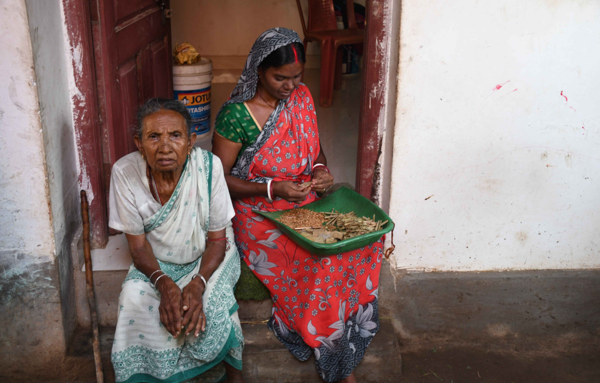 Two Kurmi women sit in their house in Jiudaru village, Purulia, West Bengal
