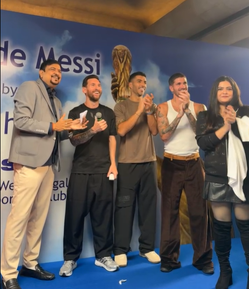  Sujit Basu and his daugher with Lionel Messi, Luis Suárez, and Rodrigo De Paul in Kolkata.