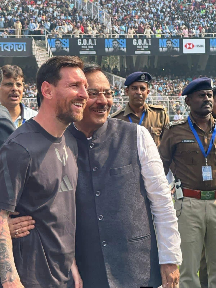 Arup Biswas with Lionel Messi. 