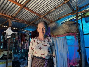 An elderly woman inside her makeshift shelter at the Lipui refugee camp in Zokhawthar (Photo: Kimi Colney / Myanmar Now)