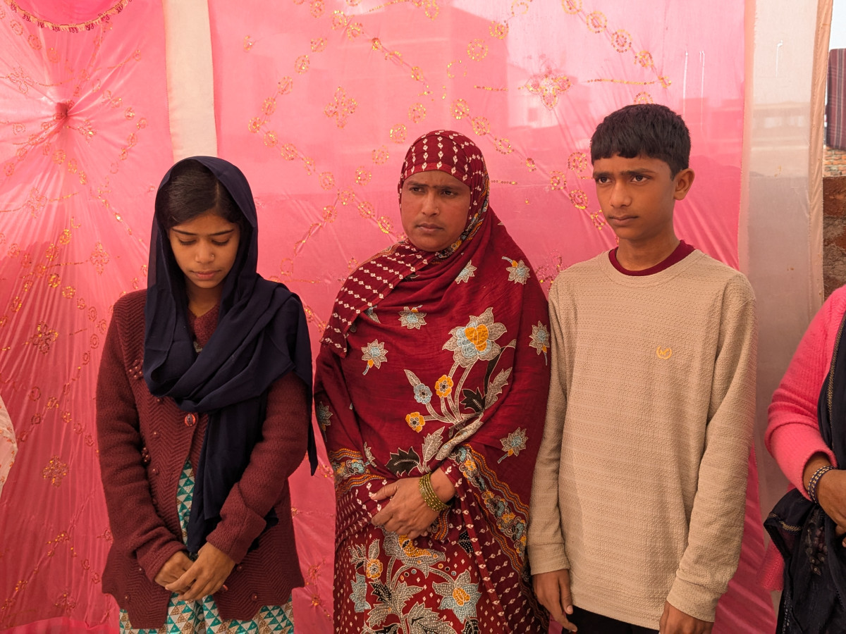 An image of Athar's wife and children.