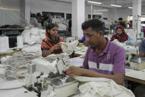 Garment workers sew clothes at a factory in Ashulia, Bangladesh. Photo by Fabeha Monir / GPJ Bangladesh