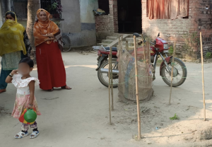 Sabina Sheikh looks on as a little girl plays near the tree where Tamanna was killed. Photo: By arrangement.