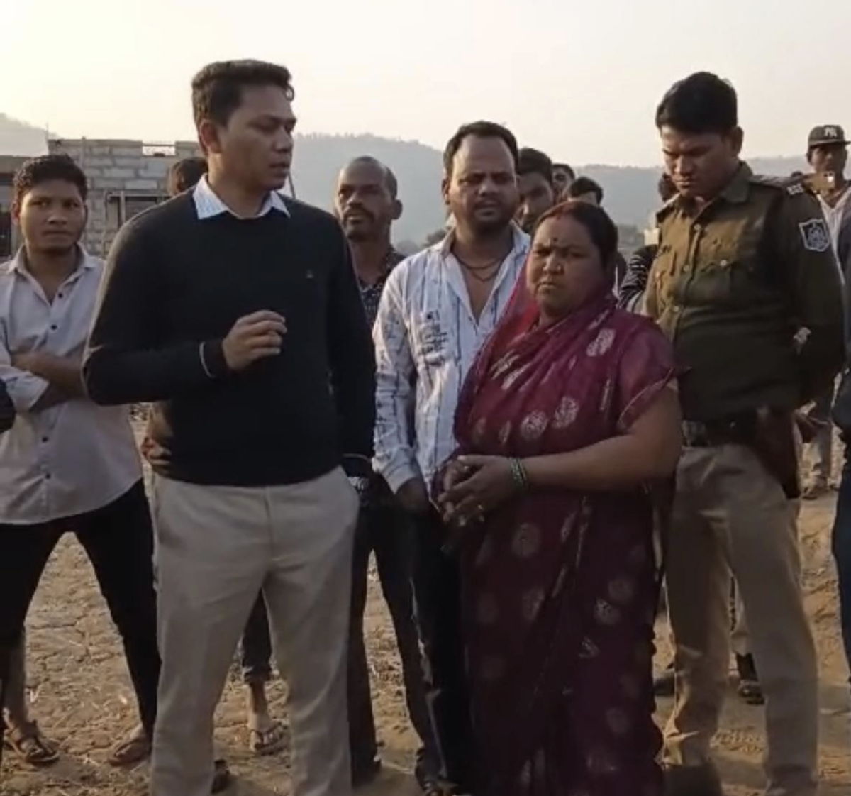 A screengrab from the video in which Sarpanch Ramrati Devi requests the SDM to stop the demolition of Abdul Naeem’s school. On the left, wearing a black sweater, is the SDM, and in a saree is Ramrati Devi.