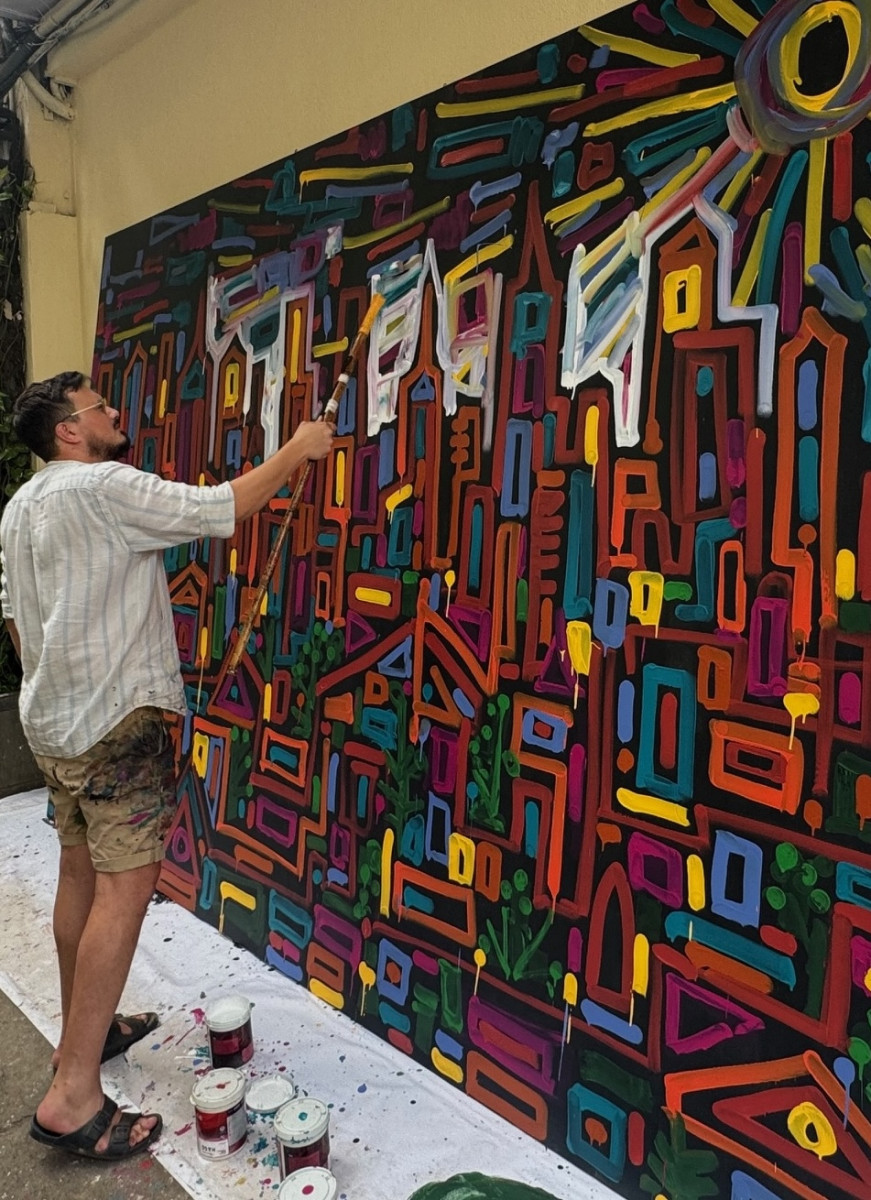 Solomon Souza painting at the Cymroza Gallery in Mumbai. Photo: John Elliott
