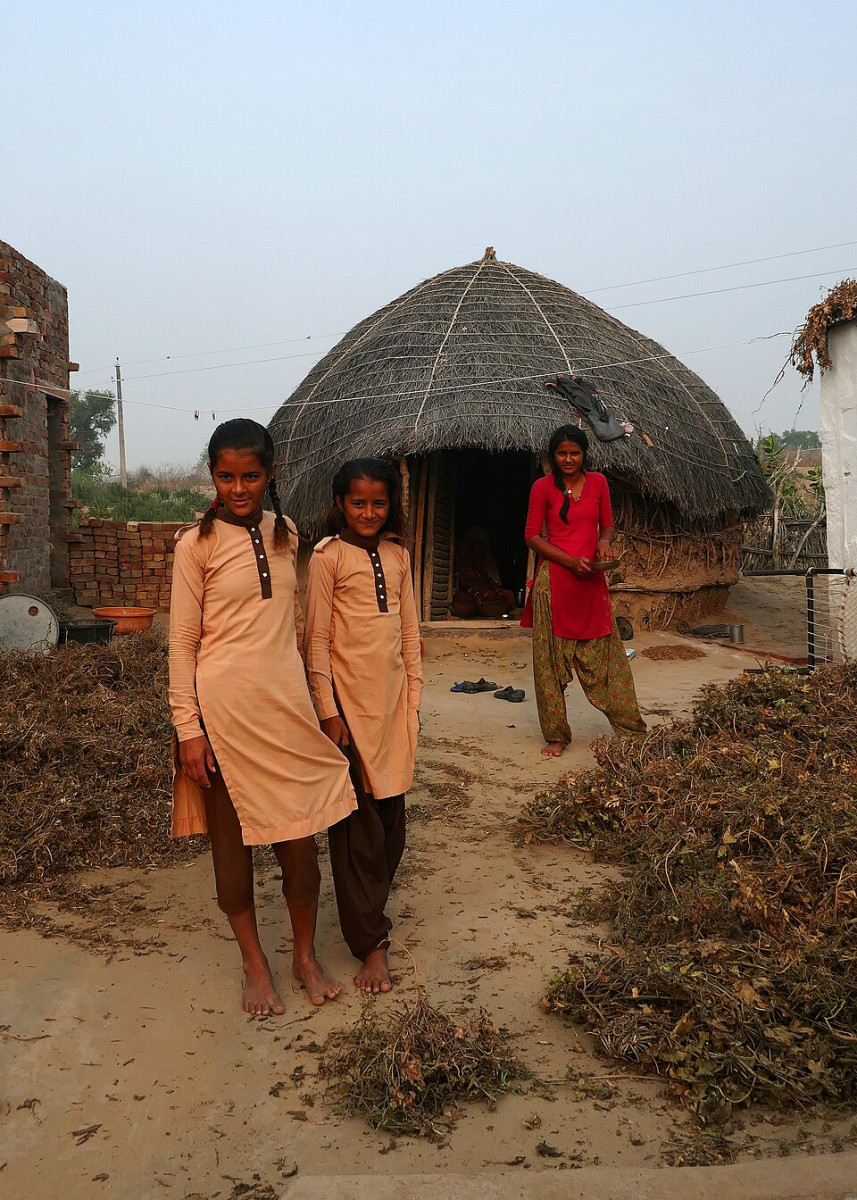 Young girls in Rajasthan 's Thar desert in their school uniforms.