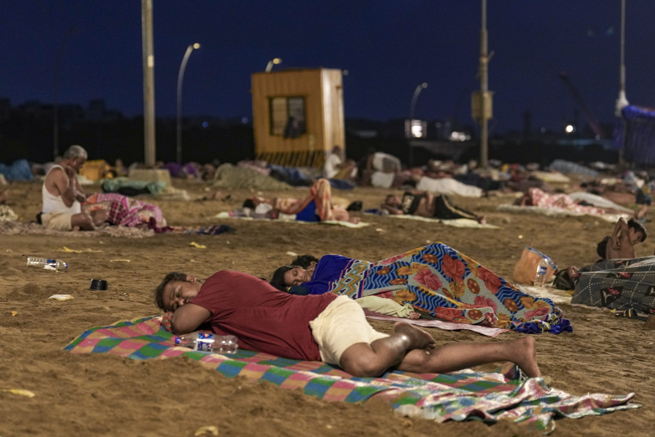 People sleeping outside during a heatwave.