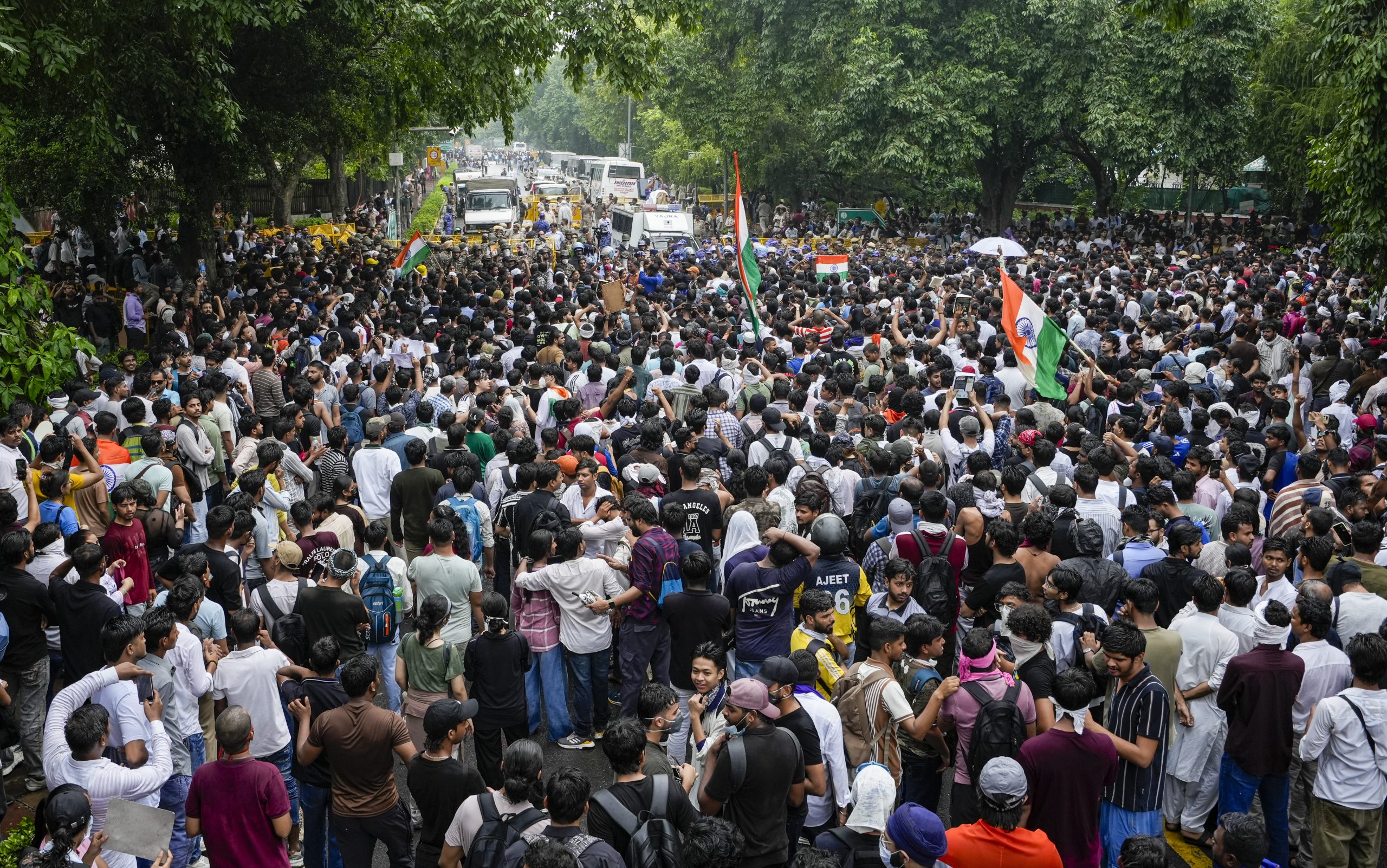 Protesters gather during a march towards Parliament demanding the resignation of Union Education Minister Dharmendra Pradhan. Photo: PTI/Atul Yadav