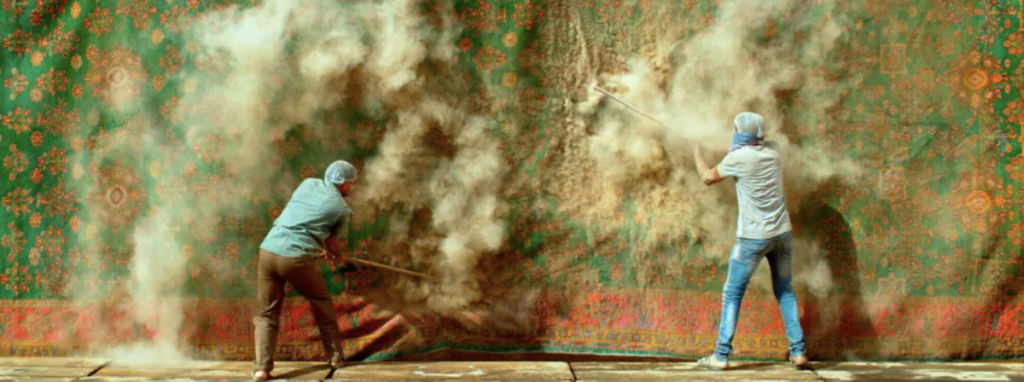 A video titled “Interference” by L.N.Tallur (2019) depicting a carpet over 200 years old from the Junagadh Museum in Gujarat being beaten to extract years of dust – questioning such abrasive restoration, or destruction