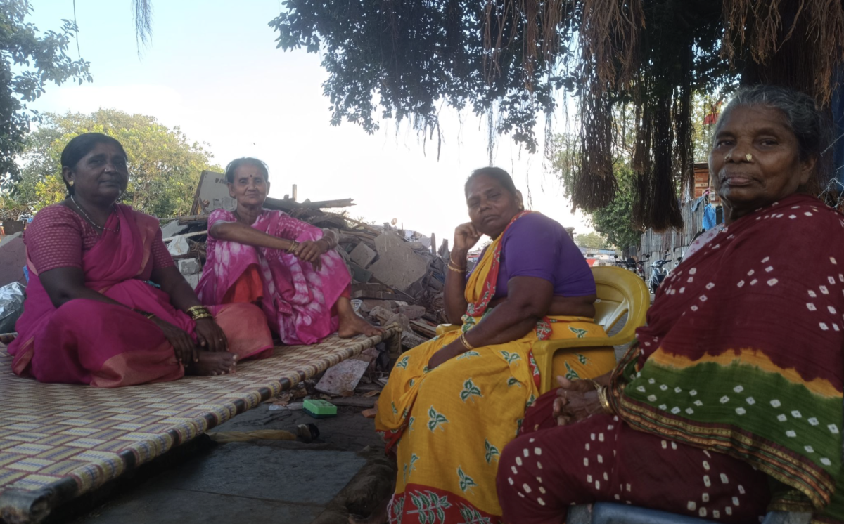 Maruti Dhondiba Bhise, Usha Sadashiv Salve, Vasantal Ramalingam Harijan, and Balayanka Harijan (left to right) sit together under the trees. Photo: Anjali D