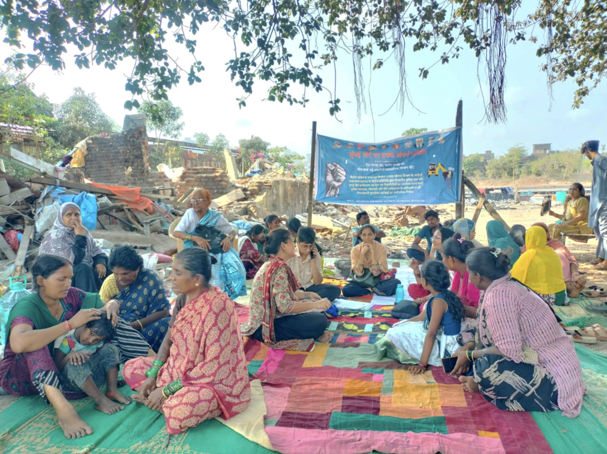 Residents sit, discuss and sing songs at the protest site. Photo: Anjali D