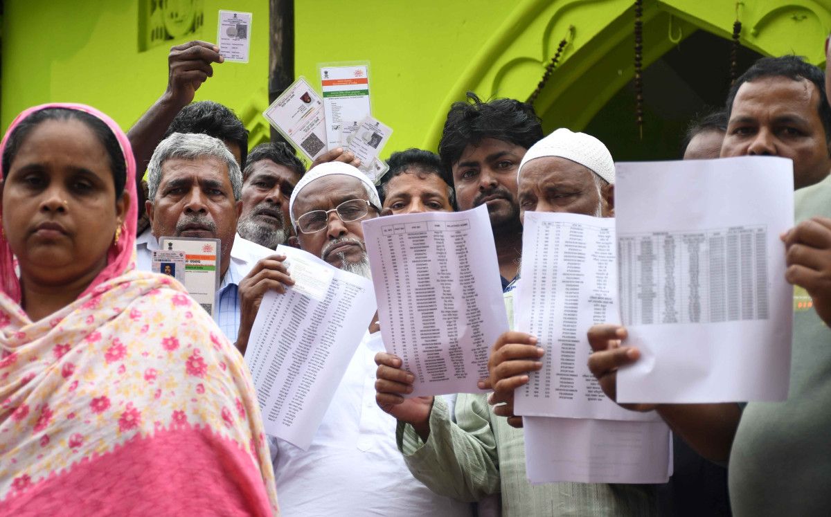 Voters of Bhatmohalla showing their documents.