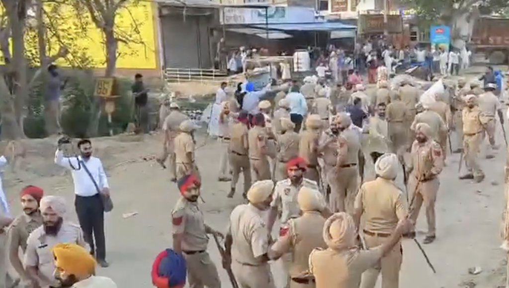 Screengrabs from the viral video showing Punjab Police taking the deceased's body away from the protesters